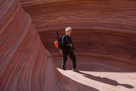 Elaine in the Spotlight Person seen against a sandstone pattern at The Wave in Coyote Buttes North, Arizona